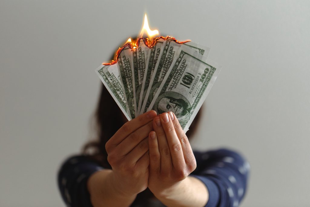 woman burning money