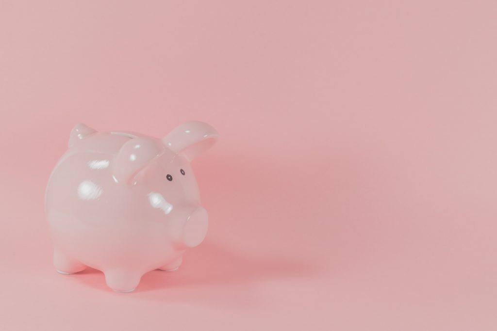 a piggy bank on a pink background