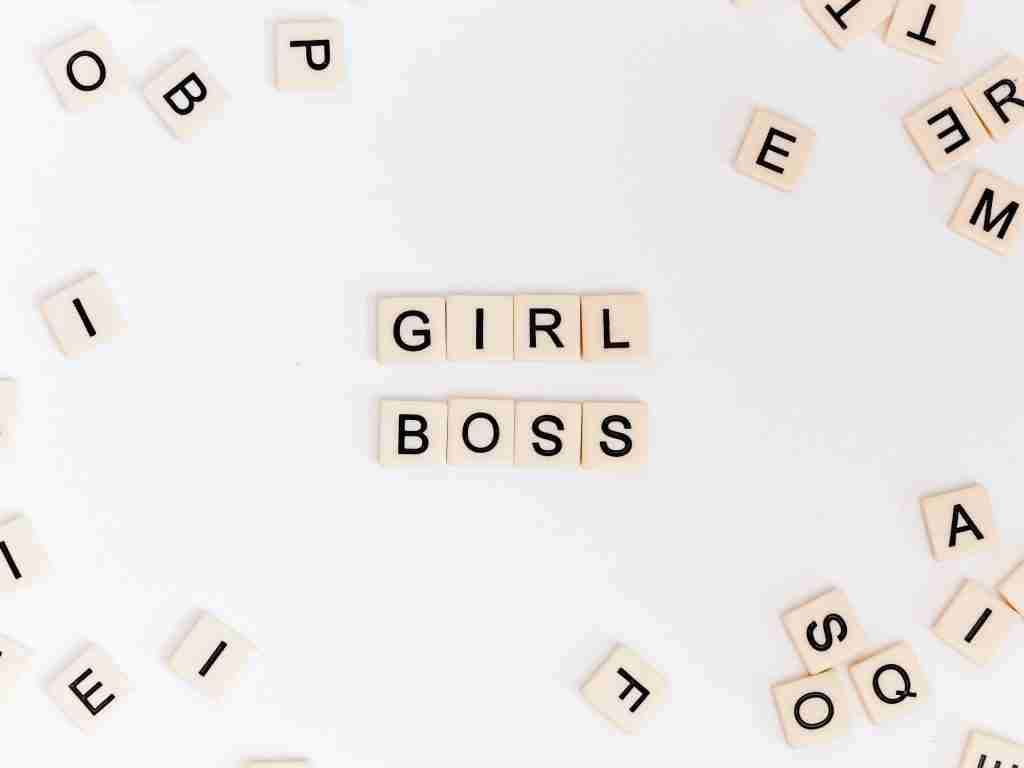 scrabble letters spelling out girl boss