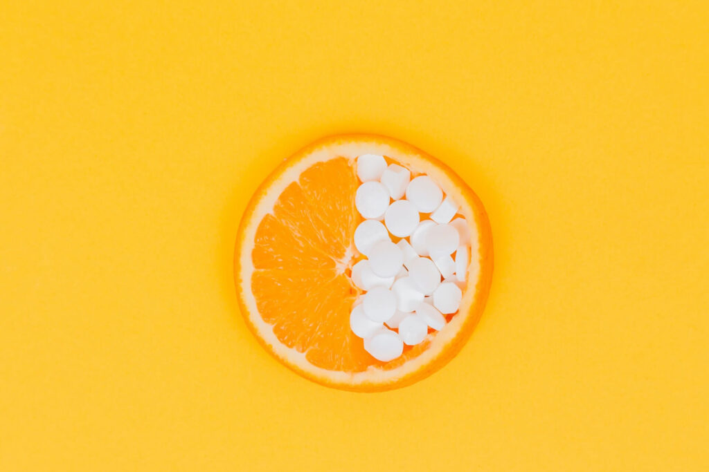 an orange and some white tablets